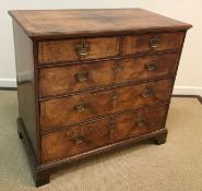 An 18th Century walnut chest,