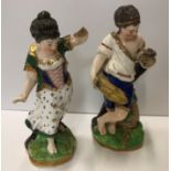 A pair of early 19th Century Chelsea figures of "A Shepherdess" and "Man with dog",