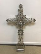 A plated cast metal ecclesiastical cross, the centre depicting the Madonna (or poss. St.