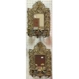 A pair of Continental brass girandole mirrors with rectangular plates in scrolling foliate frames