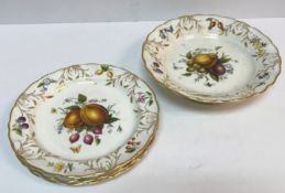 A Royal Worcester part dessert set of four plates and tazza, each with fruit decoration,