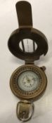 A modern reproduction brass marching compass