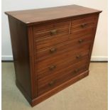 A late Victorian walnut chest of two short over three long graduated drawers on a plinth base, 102.