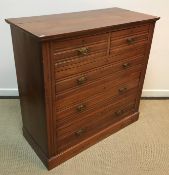 A late Victorian walnut chest of two short over three long graduated drawers on a plinth base, 102.