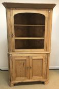 A 19th Century pine free-standing corner cabinet,