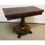 A Victorian mahogany tea table, the figured top opening to reveal a plain interior,