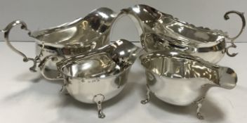 Two 20th Century silver sauce boats in matching designs,