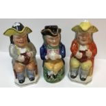 Three 19th Century pottery Toby jugs and covers as "Toby Philpott seated with jug of ale",