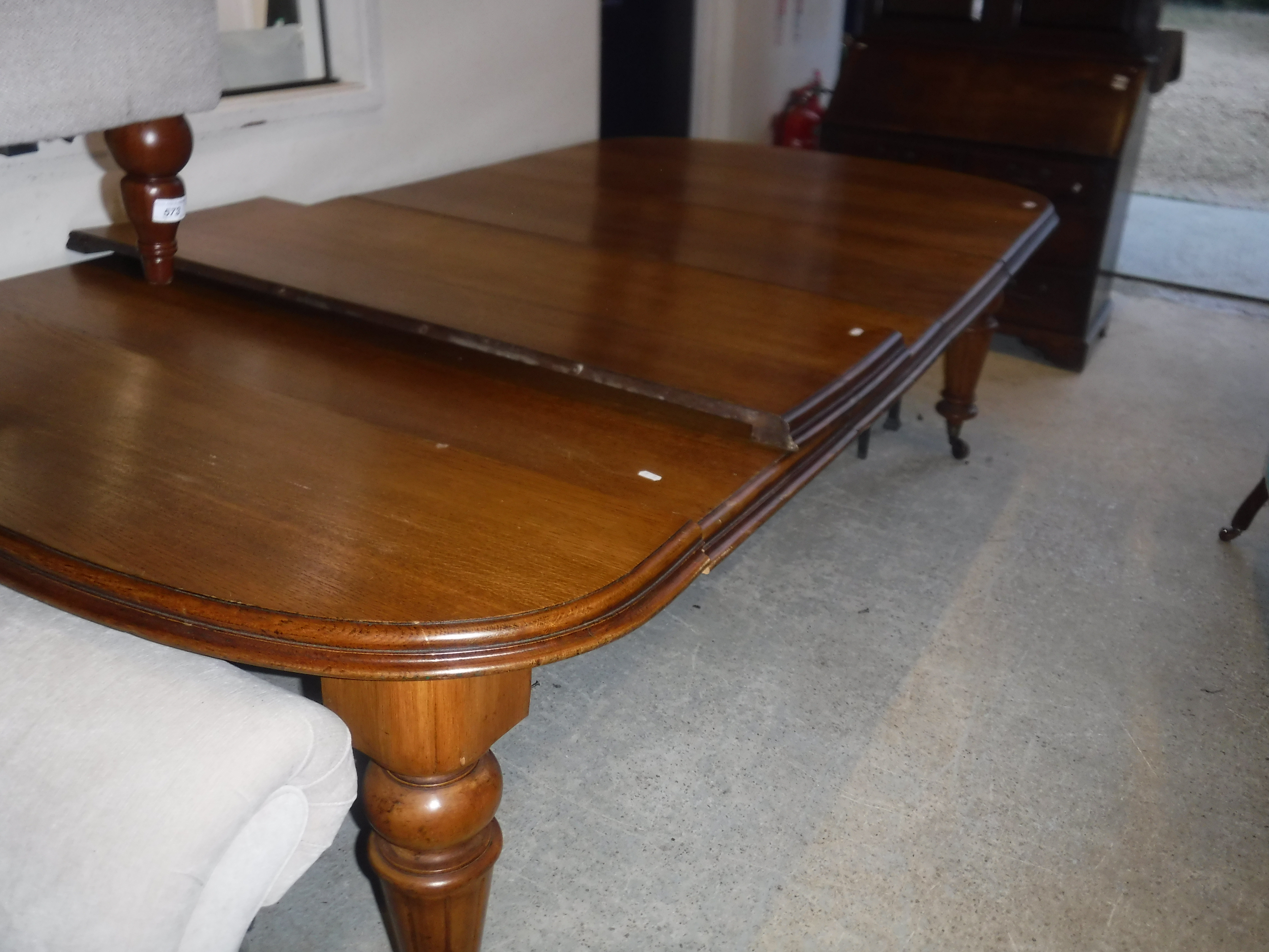 A Victorian oak shallow D end extending dining table with three extra leaves and moulded edge, - Image 8 of 20