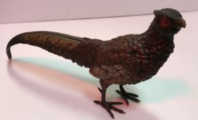 A cold-painted bronze figure of a Pheasant, stamped "Geschutz" to base, 28 cm long x 15.