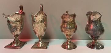 A collection of three Georgian silver cream jugs,