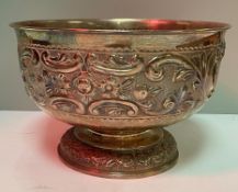 A late Victorian silver fruit bowl with embossed foliate and fruit decoration on a circular foot