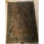 A fine silk Tree of Life Qum rug, the central panel set with a tree,