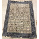 A Persian style carpet, the central panel set with all-over foliate decoration on a cream ground,