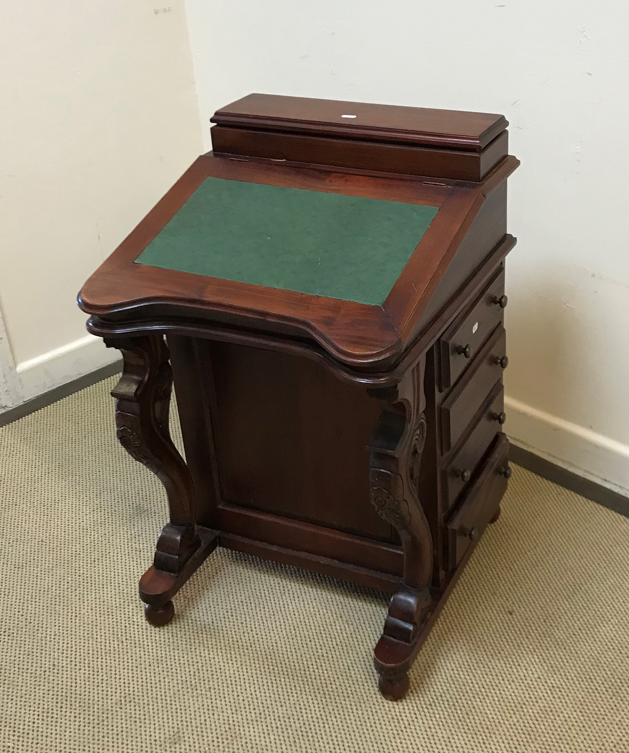 A modern mahogany Davenport desk in the Victorian style with stationery compartment over a sloping