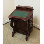 A modern mahogany Davenport desk in the Victorian style with stationery compartment over a sloping