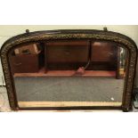 A late Victorian giltwood and gesso and simulated rosewood framed mantel mirror,