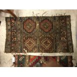 A collection of four various Caucasian rug fragments,