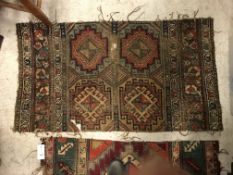 A collection of four various Caucasian rug fragments,