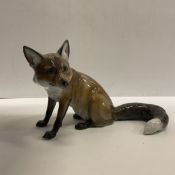A Rosenthal figure of a seated fox by M H Fritz approx.
