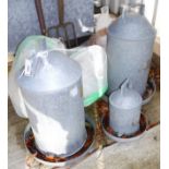 Three galvanised chicken feeders, together with a quantity of plastic versions,