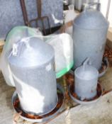 Three galvanised chicken feeders, together with a quantity of plastic versions,