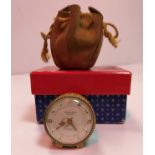 A Bueche Girod miniature bedside clock, yellow metal mounted with lidded skin banding,