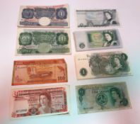 A collection of Bank of England bank notes comprising four £1 notes issued by The Government of