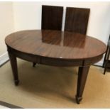 An Edwardian mahogany D end dining table on square tapered legs to spade feet (one extra leaf),