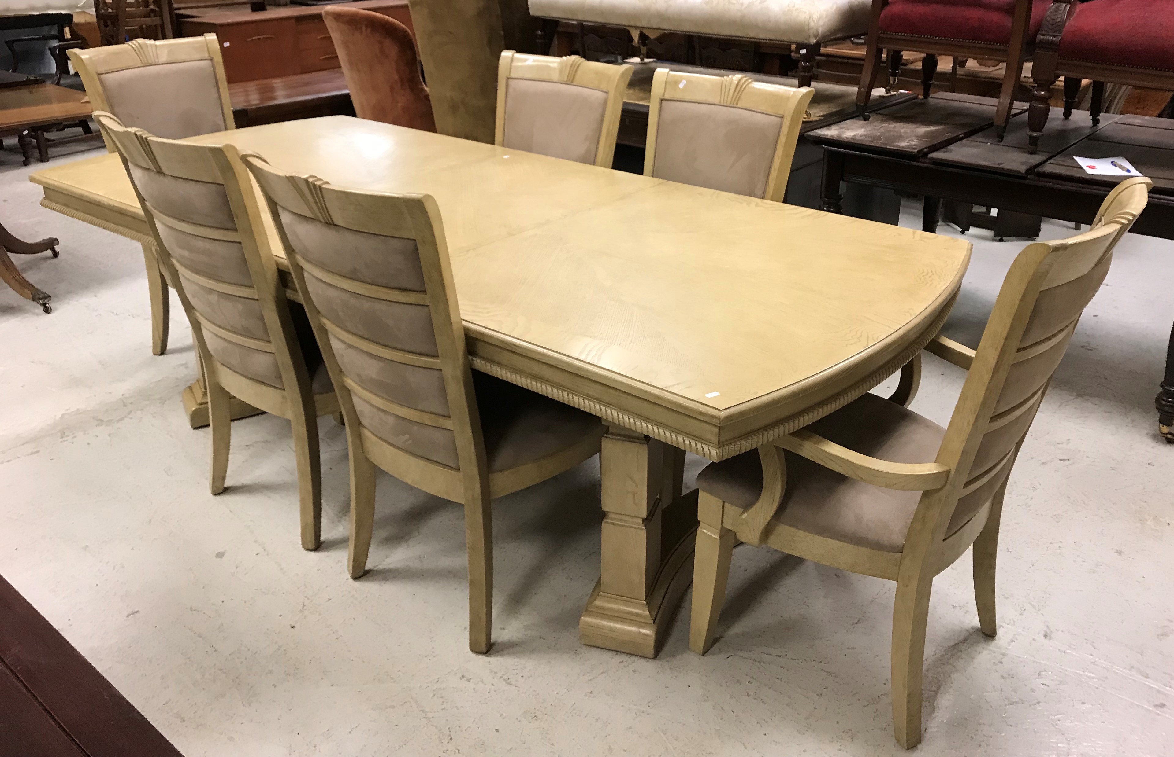 A modern stained oak and ash extending dining table on square ringed supports united by a centre - Image 2 of 50