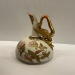 A Royal Worcester blushware jug with dragon decorated handle,