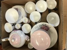 A Queen Anne "Fair Lady" rose decorated part tea set,