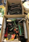 A box of various Hornby 00 and other rolling stock including carriages, trucks, track,