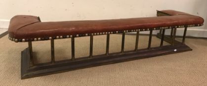 A circa 1900 brass rail club fender with brass studded leather seat (low proportions),