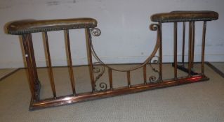 A Victorian studded leather covered copper framed club fender with scroll work centre recess 156 cm