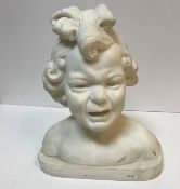 An early 20th Century carved marble bust of "Crying child with bow in her hair,