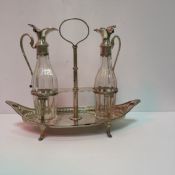 A silver Regency style boat shaped oil and vinegar cruet with two glass bottles (London 1897) 8.