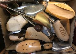 Two boxes containing a large collection of various shoe trees (mainly size 9)