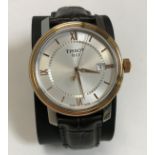 A Tissot Bridge Sport watch, together with box, instructions,