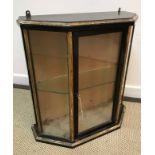 An early 20th Century ebonised and gilt decorated five sided wall hanging display cabinet,