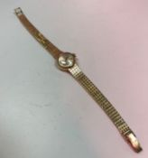 A 9 carat gold cased Omega ladies wristwatch with box and guarantee,