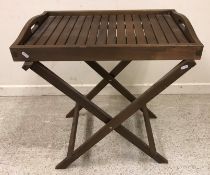 A pair of modern dark stained beech square glass top occasional tables,