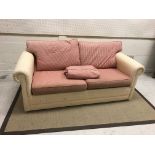 A modern check upholstered two seat scroll arm sofa,