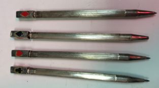 A set of four sterling silver Bridge pencils each depicting one of the four suits,