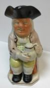 A 19th Century Staffordshire pottery Toby jug as "Toby Philpott seated with jug of ale on his left