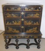 An 18th Century black lacquered and chinoiserie decorated chest on stand,