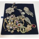 A collection of vintage paste necklaces and brooches,