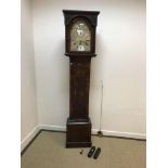 An 18th Century walnut cased long case clock, the eight day movement with silvered chapter ring,