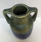 A Ruskin pottery blue/green glazed two handled urn vase, 24.