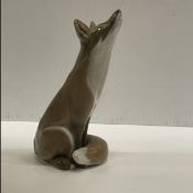 A Royal Copenhagen figure of a seated fox looking upwards (No. 1475) 14.